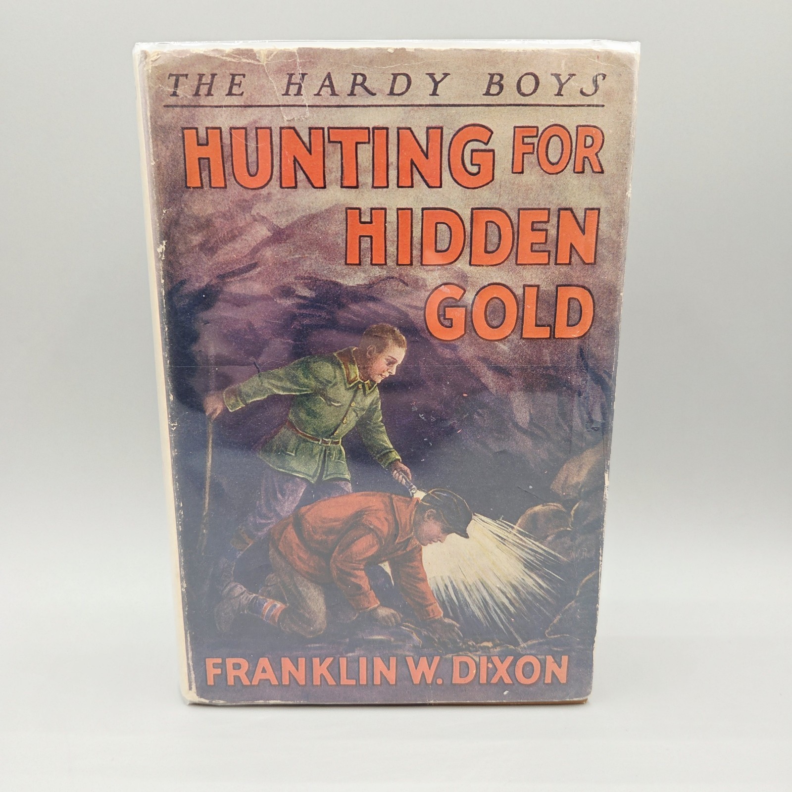 Hunting for Hidden Gold 1928 HCDJ Tan Cloth Early Cave‑Art Jacket Variant